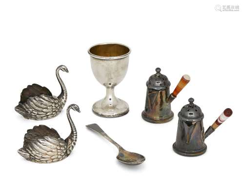 Two miniature German silver swans, both with flat bases and realistically chased with feathers,