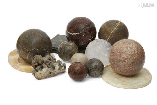 A collection of four specimen marble spheres, of recent date, 19cm diameter, with a smaller rock