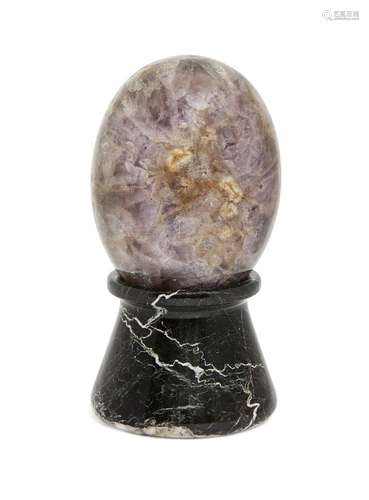 A Fluorspar specimen egg, 14cm high, on a black and veined marble stand (2)Please refer to