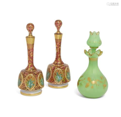 A pair of Continental glass bottles and stoppers, 19th century, decorated with panels of bulrushes