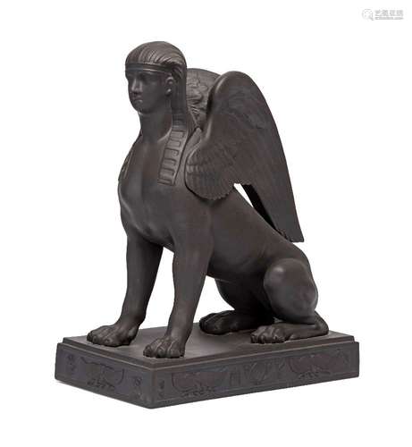 A Wedgwood black basalt model of a sphinx, late 20th century, seated on a rectangular plinth,