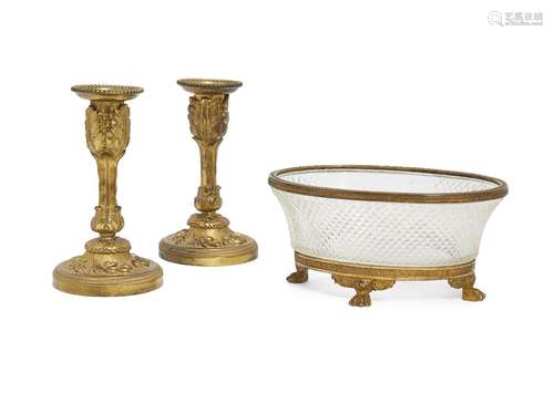 A pair of French ormolu candlesticks, late 19th/early 20th century, the columns with cast foliate