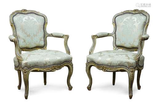 A pair of Louis XV style grey painted fauteuils, 19th Century, the cartouche shaped backrest with