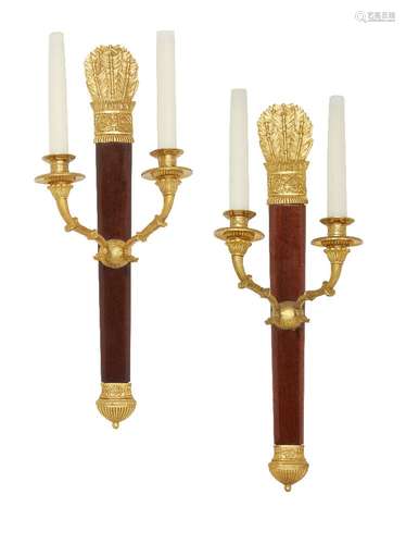 A pair of French Empire style wall lights, 20th century, the backplates formed as Neoclassical arrow