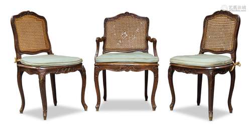 A Louis XV beech and caned fauteuil, mid 18th Century, the cartouche shaped backrest, having