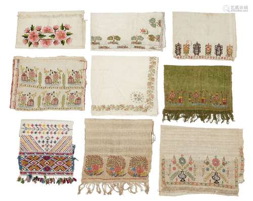 A collection of Turkish embroidered linen towels and cloths, mostly early 20th century, together