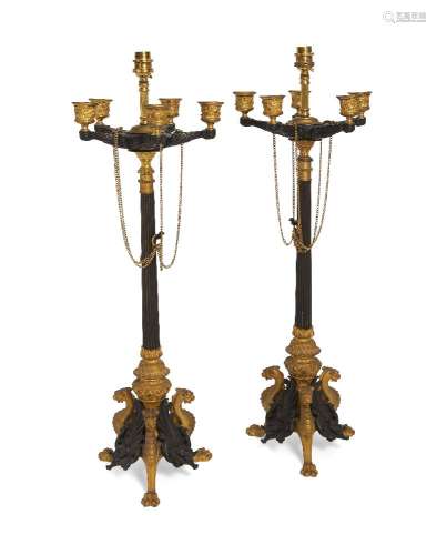 A pair of bronze and gilt bronze table lamps, in the style of Empire five light candelabra, late