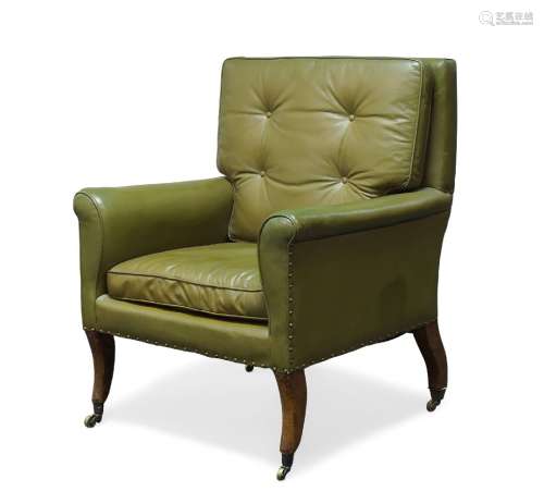 A Regency library armchair, with square back and curved armrests, upholstered in green leather,