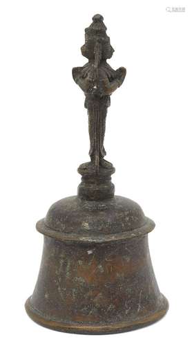 An Indian bronze bell, 20th century, with a figural handle, 20.5cm highPlease refer to department