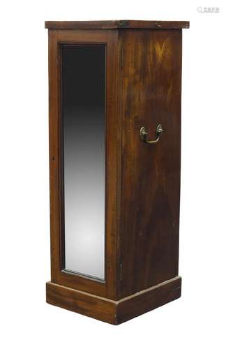 A Regency mahogany narrow cupboard, with brass handles to sides, the later mirrored door enclosing