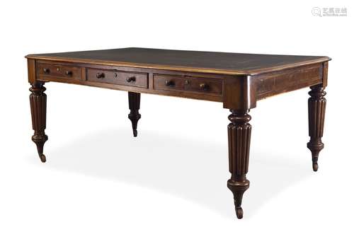 A Regency mahogany writing table, the rounded rectangular top inset with green leather writing