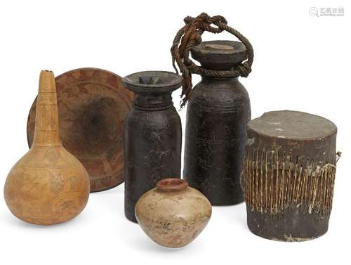 Two African hardwood flasks, of turned cylindrical form and flaring necks, with stoppers, 21 and