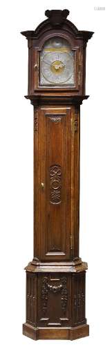 A French oak long case clock, 18th /19th Century, the arching hood with carved basket of flowers,