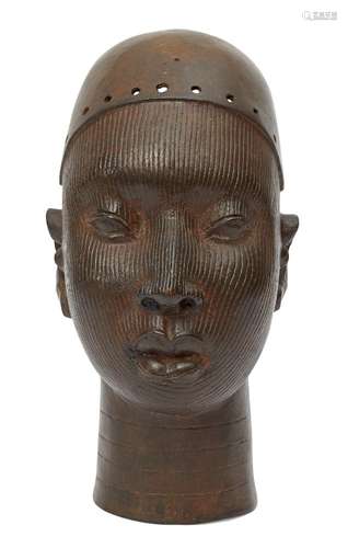 A bronze female head, Yoruba, in the 14th century style, 20th century, her face carved with