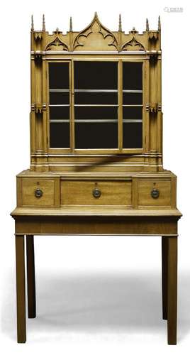 A Gothic Revival bookcase on associated stand, late 19th Century/early 20th Century, of