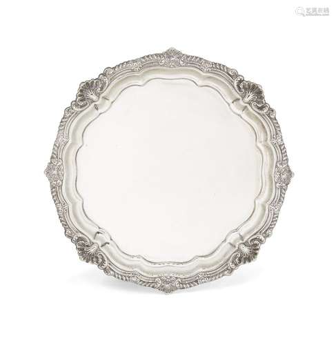 An Edwardian silver salver, London, c.1901, Harrison Brothers and Howson, raised on four scroll