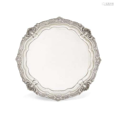 An Edwardian silver salver, London, c.1901, Harrison Brothers and Howson, raised on four scroll