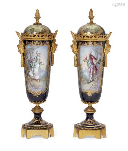 A pair of French porcelain and gilt metal mounted vases, late 19th century, the lids with acorn