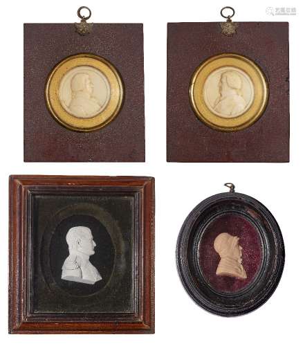 A pair of round wax relief portraits of two gentlemen, 19th century, each in a red lacquered frame