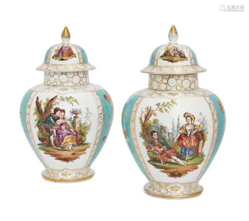 A pair of German Dresden porcelain vases and covers, late 19th/early 20th century, decorated with