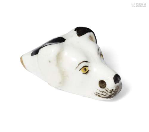 A small Staffordshire pottery whistle in the form of a dog's head, 19th century, 3.3cm longgood