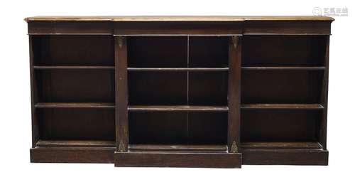 A mahogany break front open bookcase, 19th Century, with three open compartments, each having two