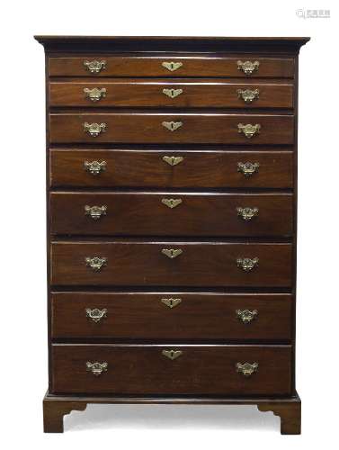 An unusual George III mahogany tall chest of drawers, possibly Irish, with three long graduated