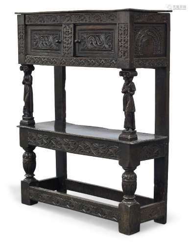 A carved oak court cupboard of diminutive proportions, incorporating 17th Century elements, the