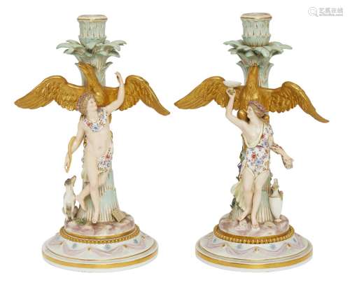 A pair of Meissen porcelain allegorical candlesticks, probably candelabra bases, late 19th