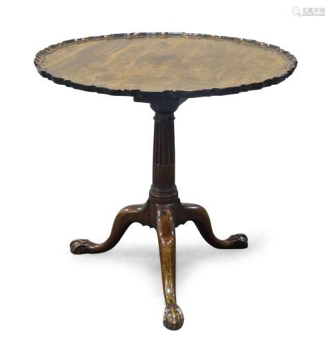 A George III mahogany tilt top occasional table, the circular pie crust top above tapering stop