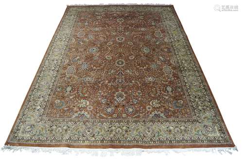 A Kashan rug, mid/late 20th Century, with ivory and blue medallion in red foliate decorated field,