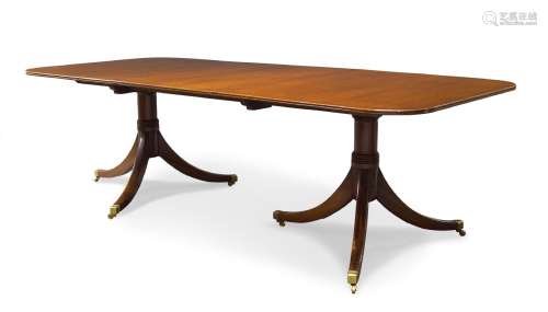 A George III style mahogany twin pedestal dining table, second half 20th Century, the rounded