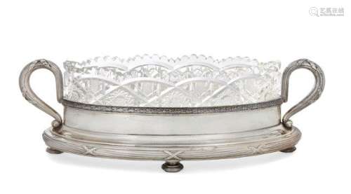 A Russian cut glass dish raised on a silver stand, by Faberge, the navette-shaped cut glass dish,
