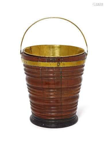 A Dutch brass bound peat bucket, 19th century, with ring turned body and brass collar and swing