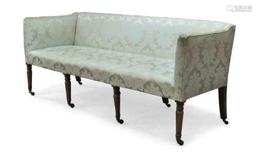 A George Ill Sheraton sofa, upholstered in cream damask pattern upholstery, raised on front turned