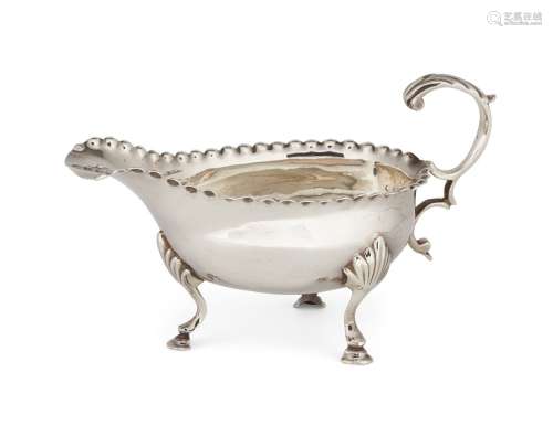 A George III small silver sauce boat, London, c.1775, William Cattell, designed with a punch-bead