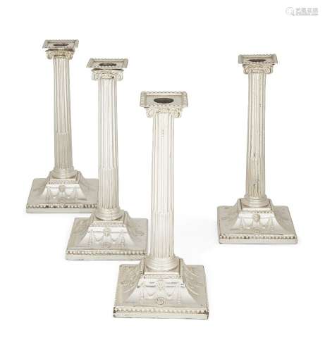 A set of four George III silver candlesticks, three London, c.1775, probably John Carter II, one