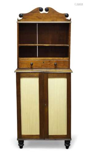 A George IV and later mahogany bookcase cabinet, the top section with raised shaped back, above open