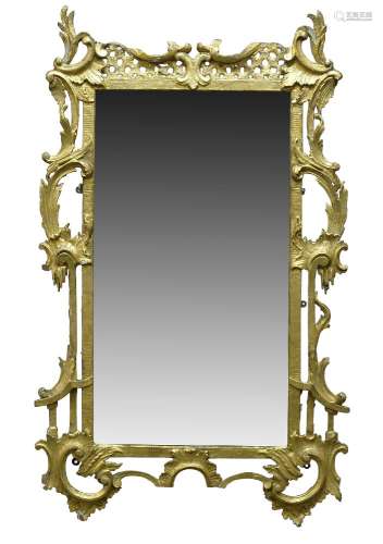 A giltwood and gesso wall mirror, in the Chippendale taste, 18th Century, the pierced frame with