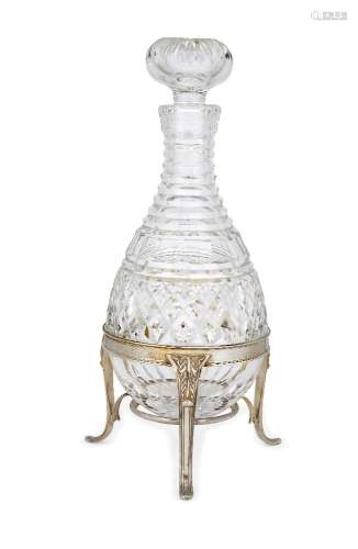 A rounded cut glass decanter raised on a silver stand, London, c.1973, Asprey & Co., the silver