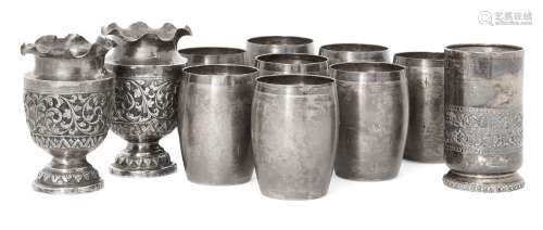 Eight Indian barrel beakers, seven stamped T100 for silver, each designed as a barrel and