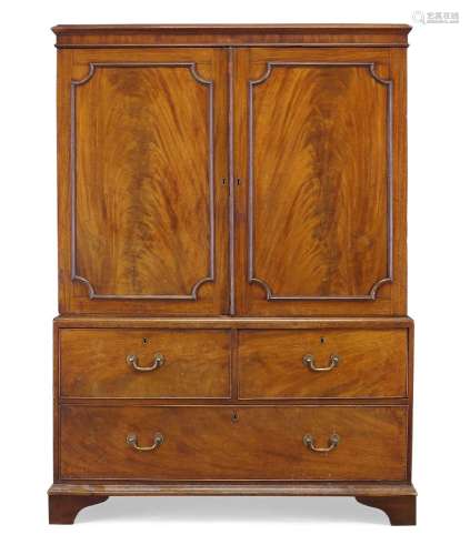 A George III mahogany linen press, the moulded top above two paneled doors enclosing five linen