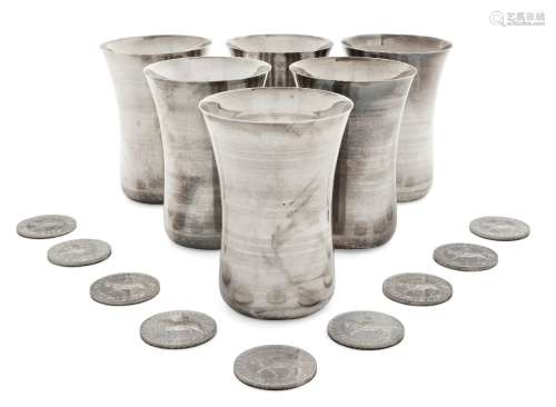 Six Indian silver water beakers, of waisted form, two with personalised engraving to lip, together