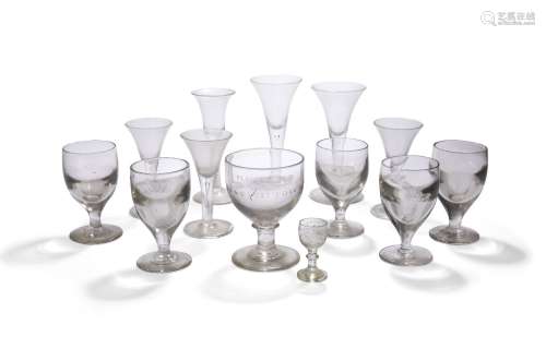 A George III drinking glass, with inverted bell form bowl, on white and lattice twist form stem,