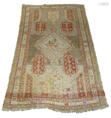 A Turkish rug, early 20th Century, with hook edged pole medallion and multiple border, 228cm x