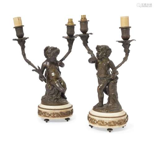 A pair of French bronze and marble two light candelabra, late 19th century, moulded with figures