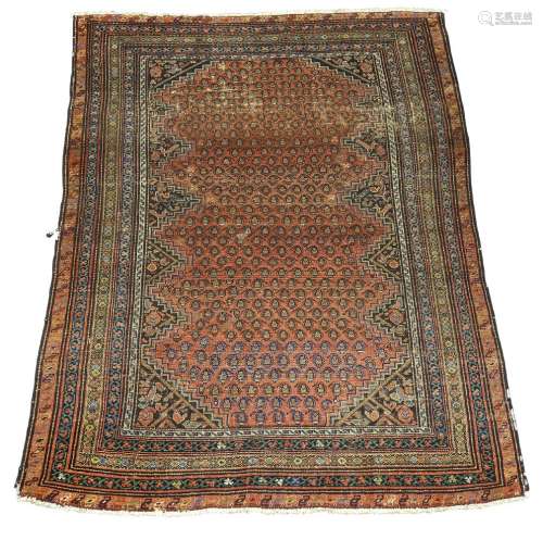 A Bijar rug, early 20th Century, with rows of Botehs in deep red field and with multiple border,