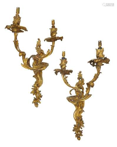A pair of French gilt bronze twin light wall lights, 20th century, with a scrolling and foliate