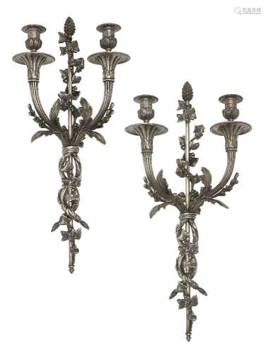 A pair of French Louis XVI style silvered metal two branch wall lights, late 19th/early 20th