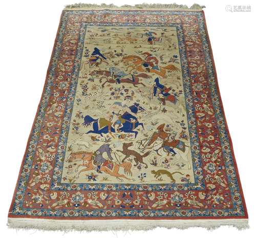 A Kashan hunting rug, mid/late 20th Century, with huntsman on horseback chasing wild beasts, 233cm x